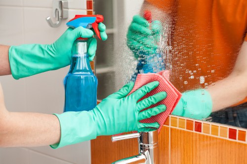 Carpet cleaning team preparing equipment safely